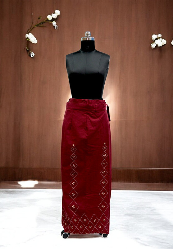 Close-up of detailed hand embroidery on cotton fabric