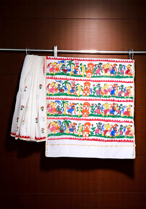 Close-up of hand-painted Pattachitra motifs on saree