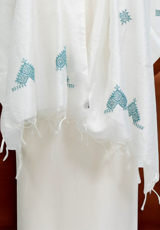 Vibrant hand-stitched Kasuti patterns on soft fabric