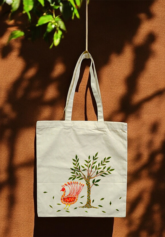 Bhil art tote bag with tribal hand painting.