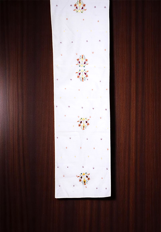 Chamba Rumal table runner styled on a wooden table